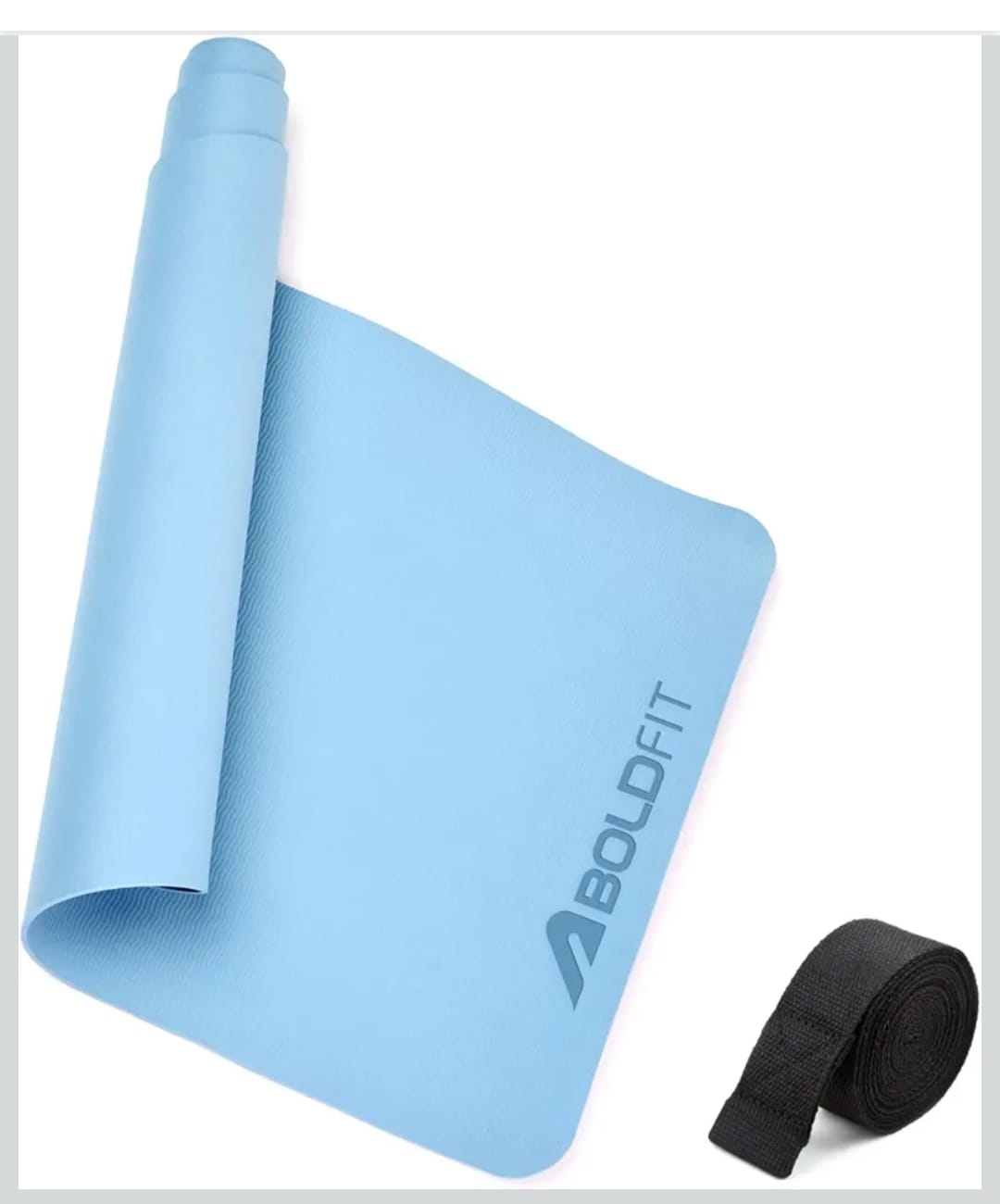 "Light blue Boldfit yoga mat partially rolled with a black strap placed beside it for easy carrying."
